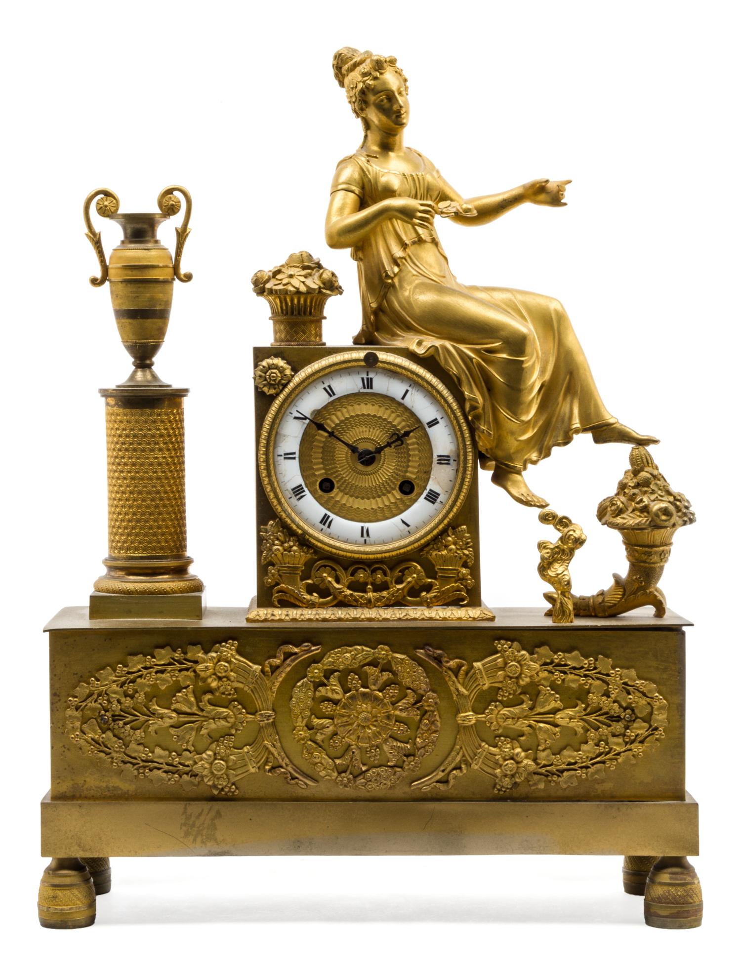 An Empire Gilt Bronze Mantel Clock Height 16 3/4 inches.