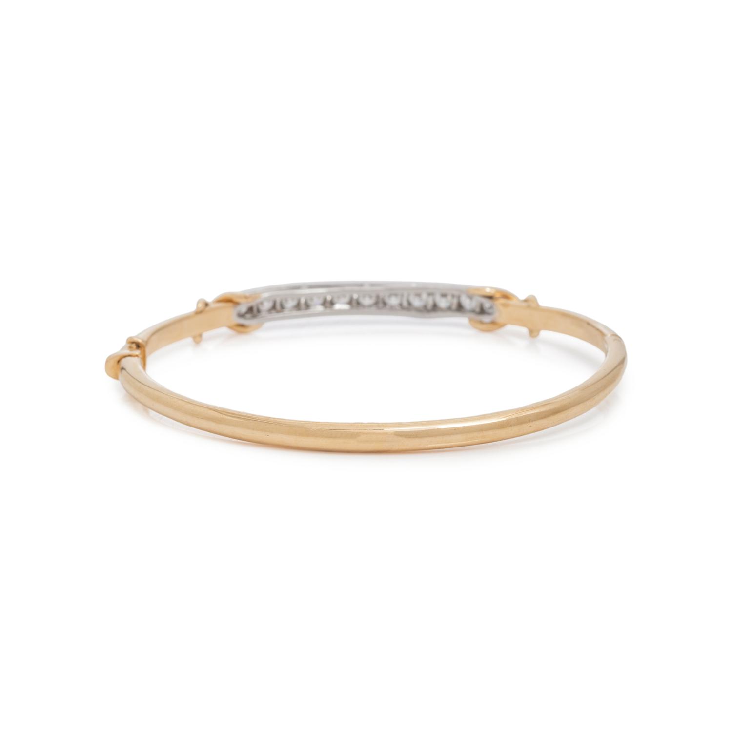 TIFFANY & CO., YELLOW GOLD, PLATINUM AND DIAMOND BANGLE BRACELET