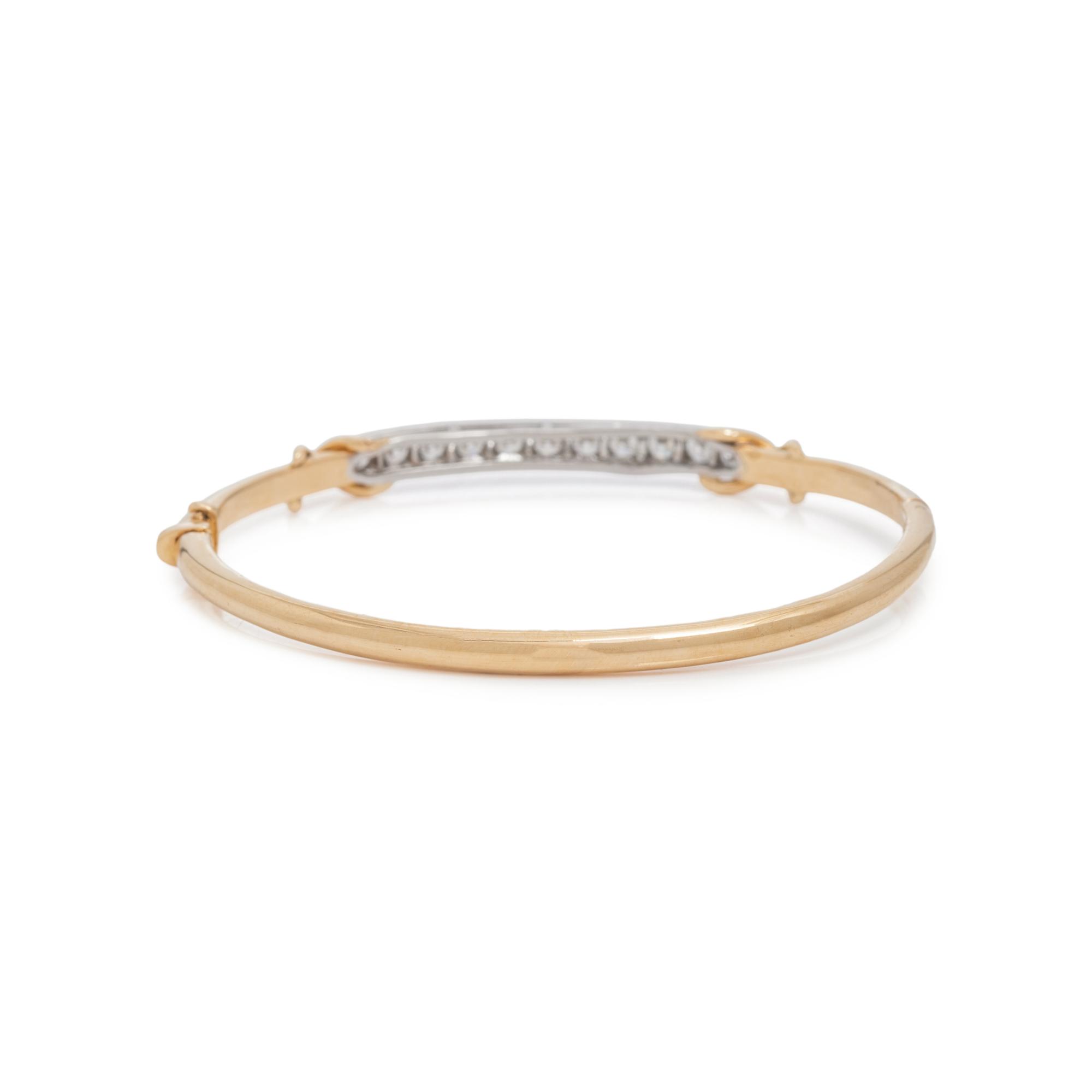TIFFANY & CO., YELLOW GOLD, PLATINUM AND DIAMOND BANGLE BRACELET