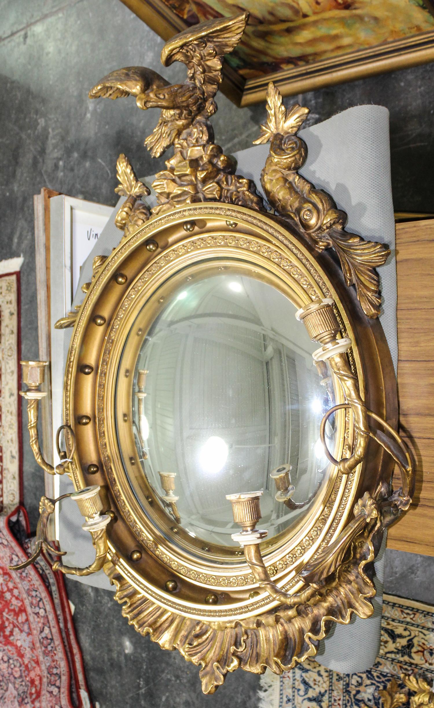 A Federal Style Giltwood Bullseye Mirror Length overall 39 1/2 inches.