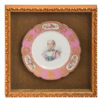 A Group of Seven Framed Sèvres Style Porcelain Plates