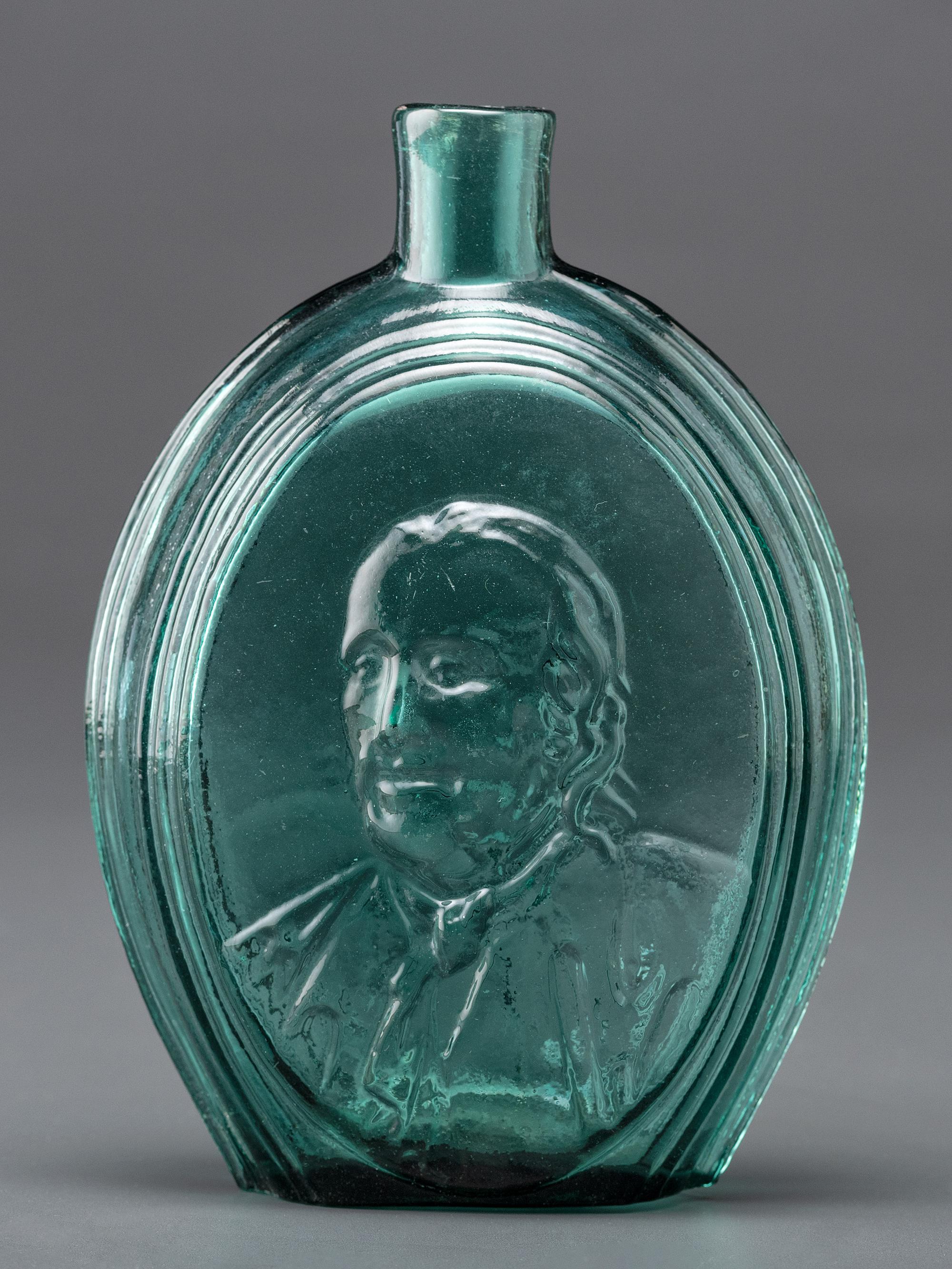 A Benjamin Franklin Portrait Flask in Green Glass by Kensington Glass Works, Philadelphia