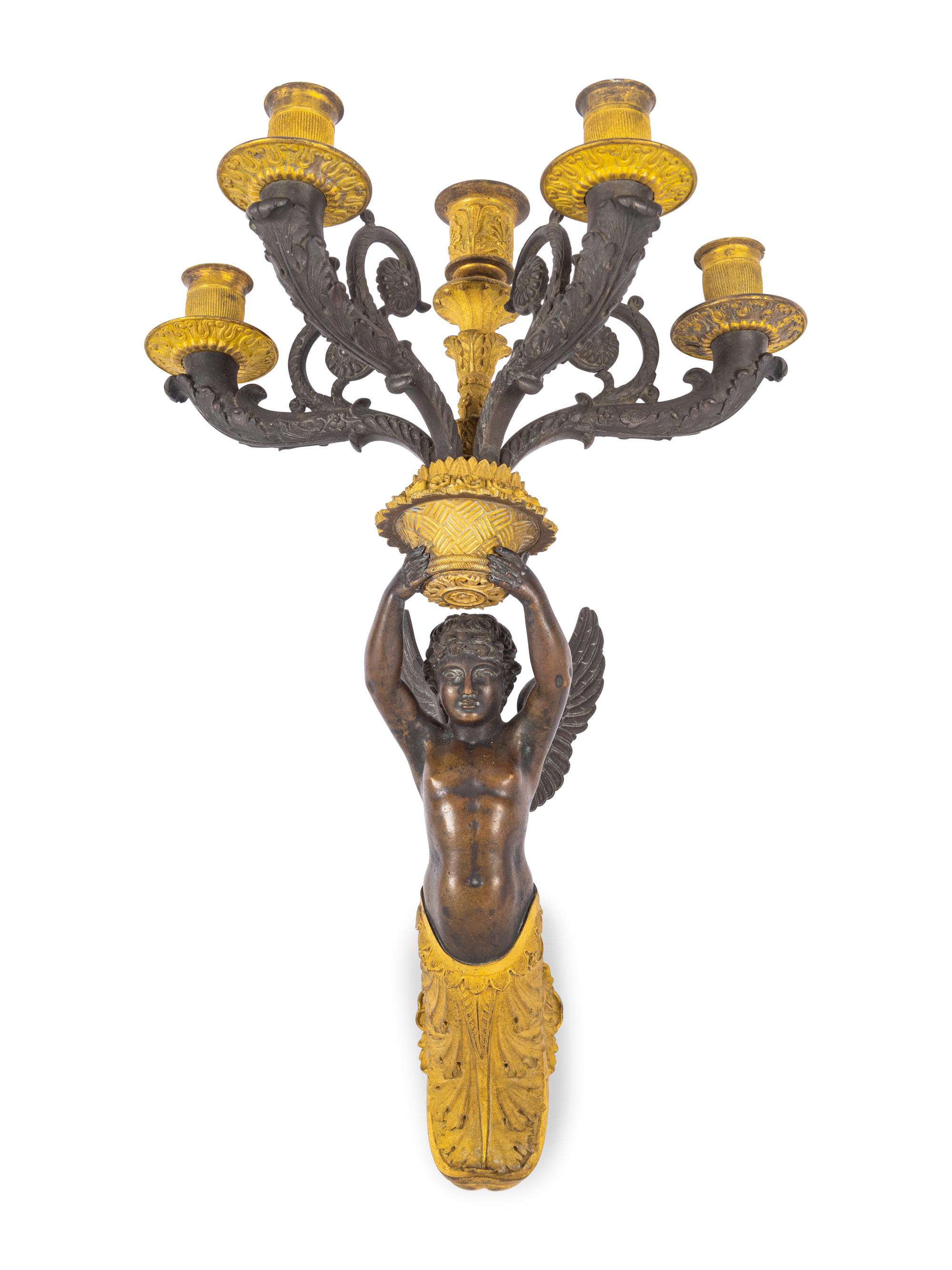 A Pair of Empire Style Gilt and Patinated Bronze Figural Five-Light Sconces