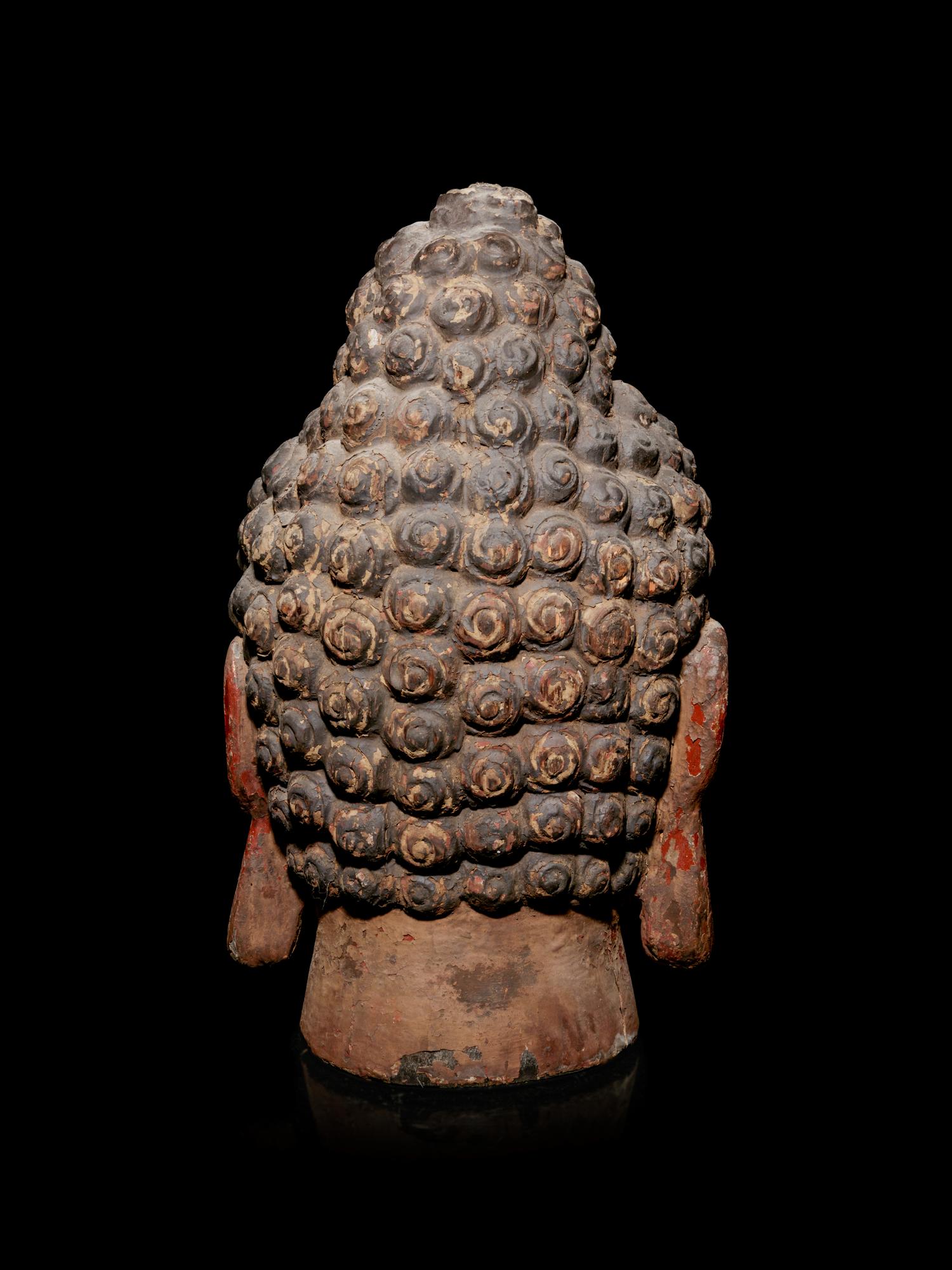 A Carved Wood Head of Buddha