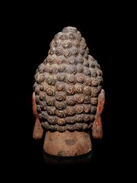 A Carved Wood Head of Buddha