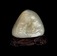 A Chinese White and Russet Jade Boulder