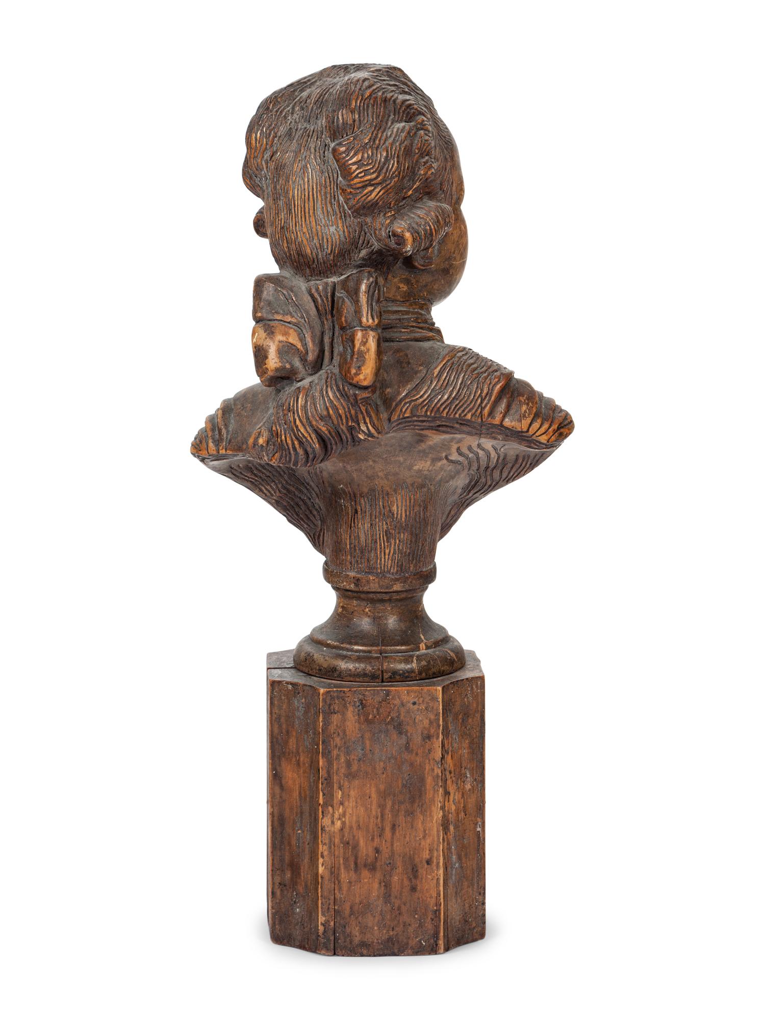 A French Carved Fruitwood Bust of a Young Louis XVI