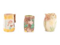 Three Large Glazed Earthenware Pitchers