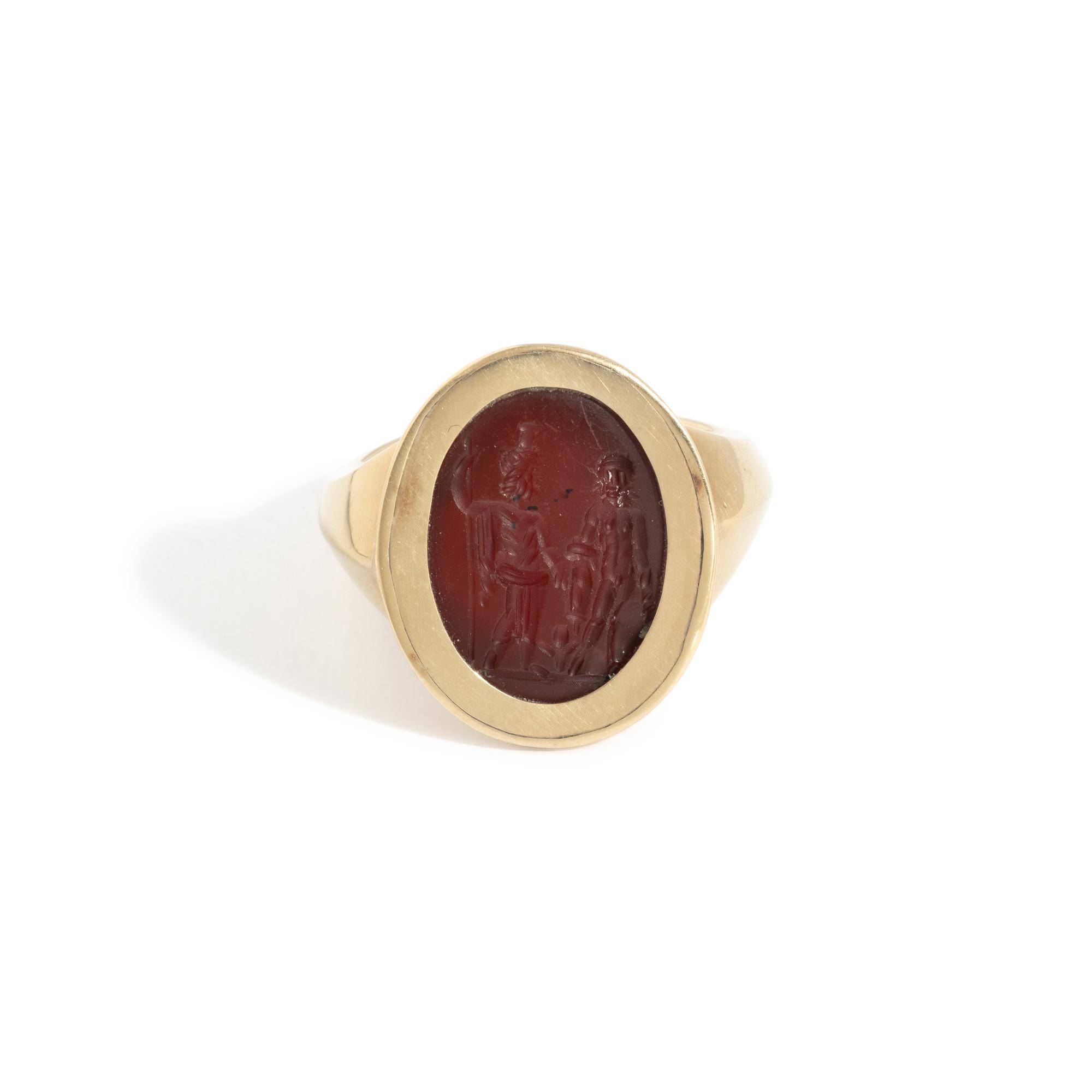 A Roman Carnelian Ring Stone with Two Male Deities and a Child — Set in a gold ring