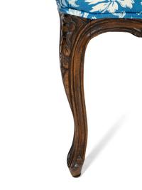 A Pair of Louis XV Style Walnut Fauteuils