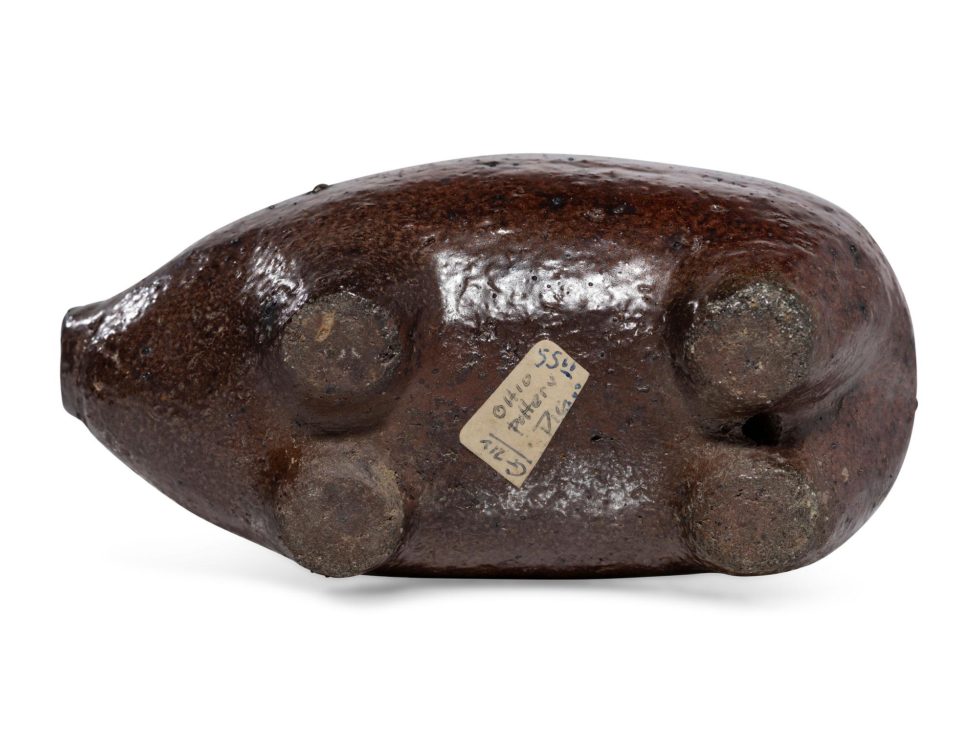 An Ohio Brown-Glazed Sewer Tile Pig