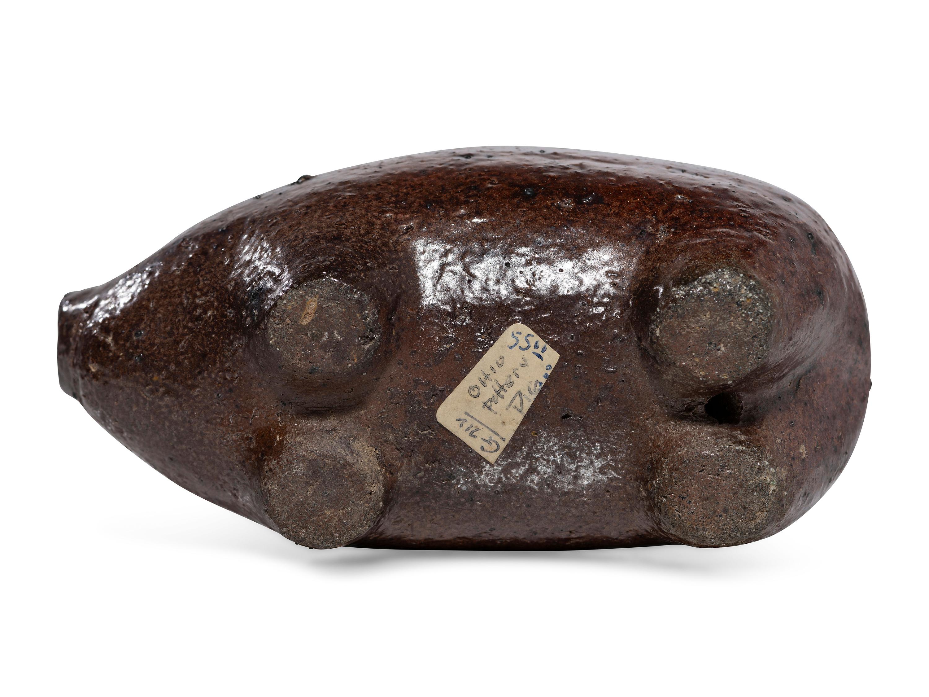 An Ohio Brown-Glazed Sewer Tile Pig