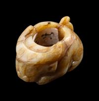 A Chinese Archaistic Yellow Jade Buffalo-Form Archer's Ring