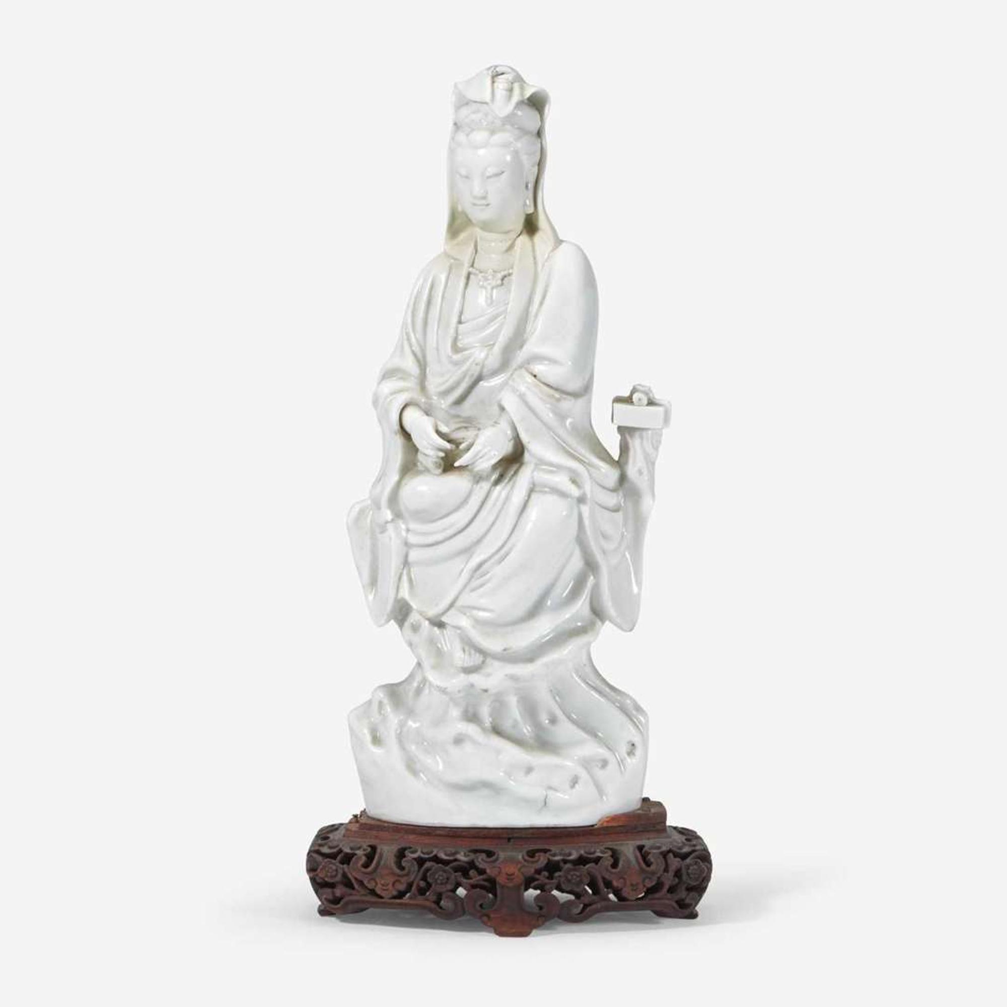 A Chinese Dehua porcelain figure of Guanyin 18th century or earlier