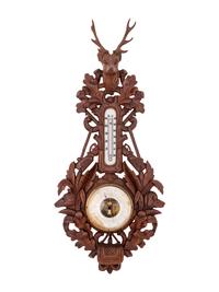 A Black Forest Carved Barometer and Thermometer
