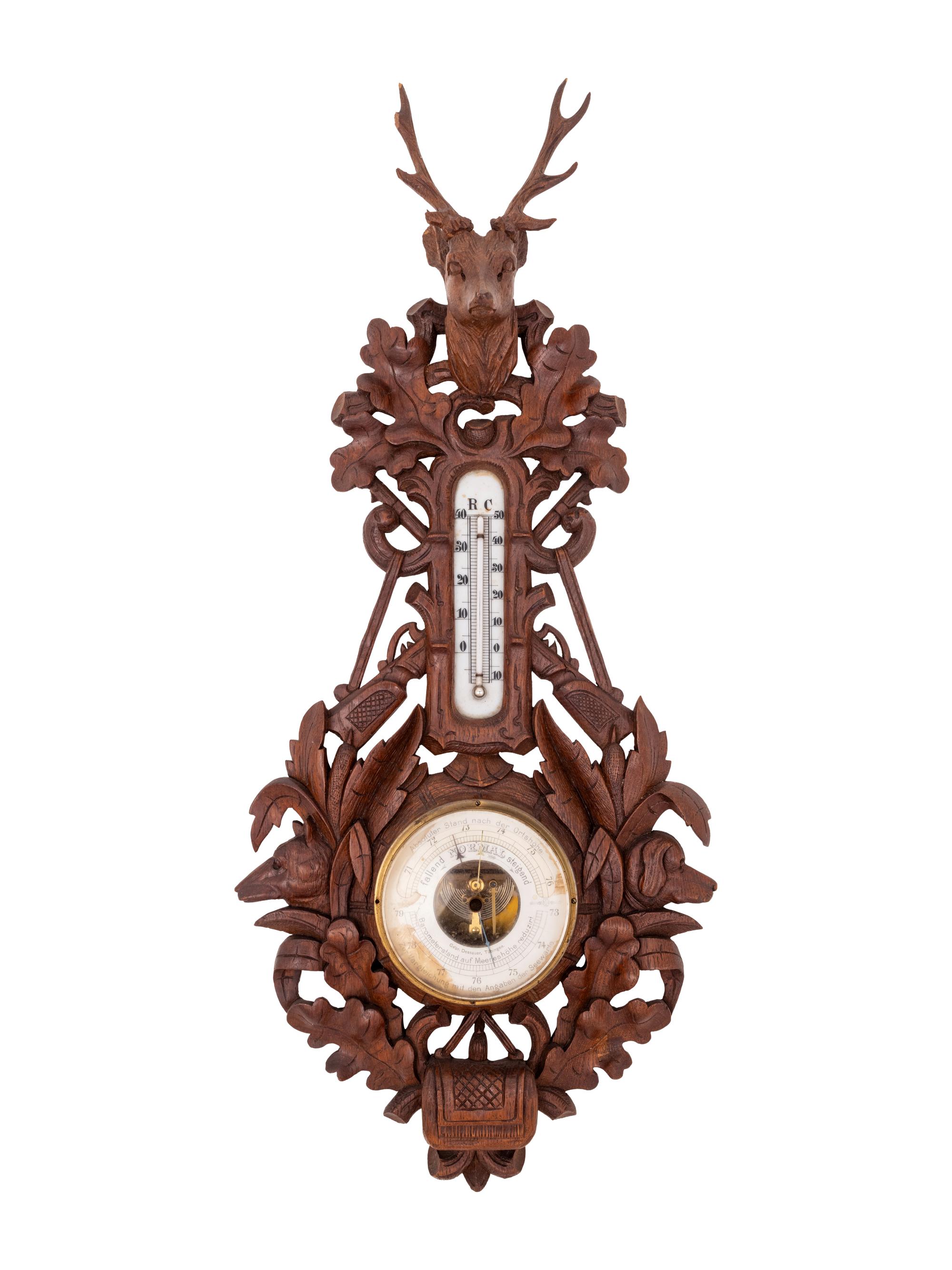 A Black Forest Carved Barometer and Thermometer