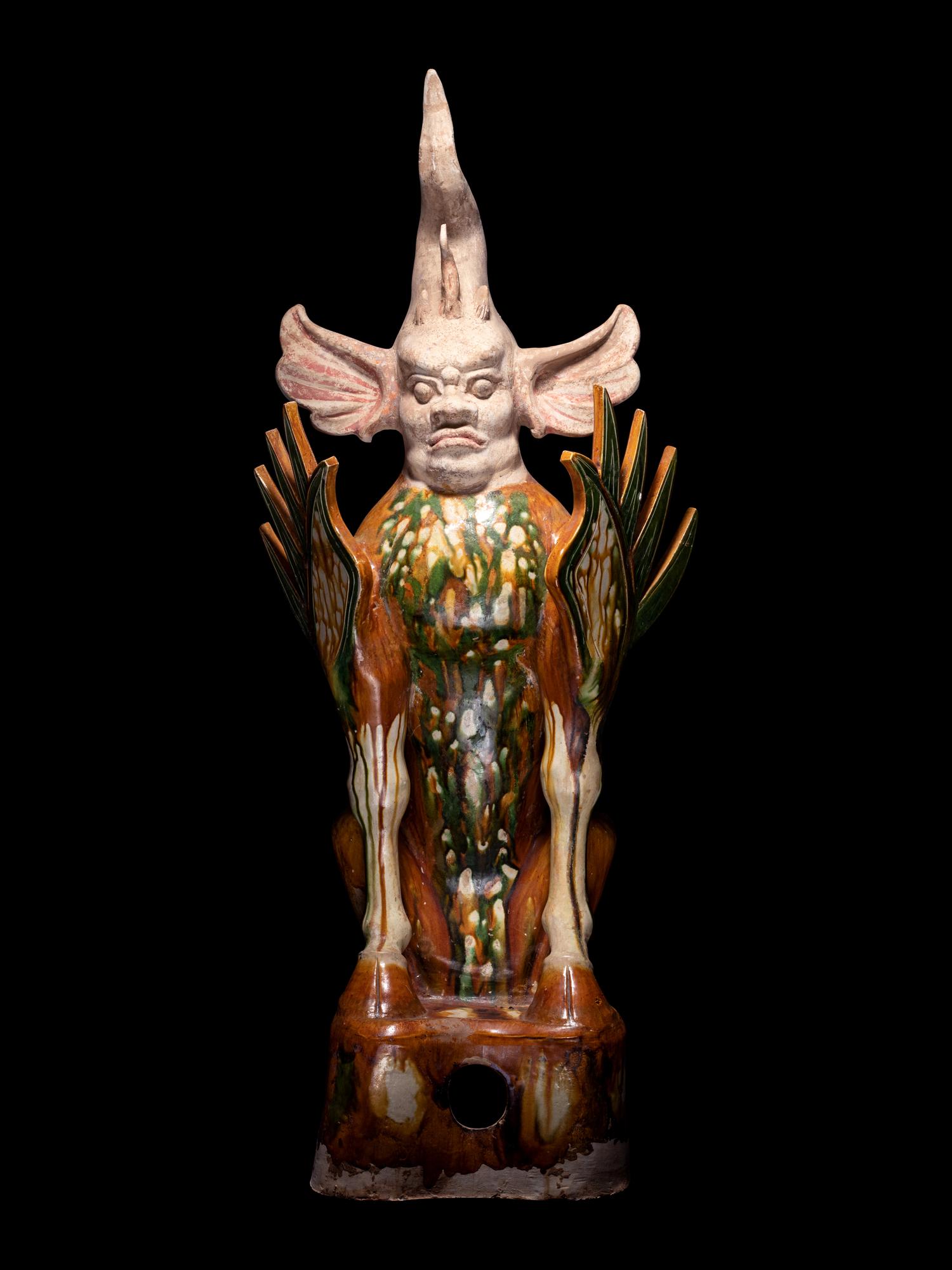 A Chinese Sancai Glazed Pottery Figure of an Earth Spirit, Zhenmushou