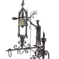 A Victorian Wrought Iron Figural Dinner Bell
