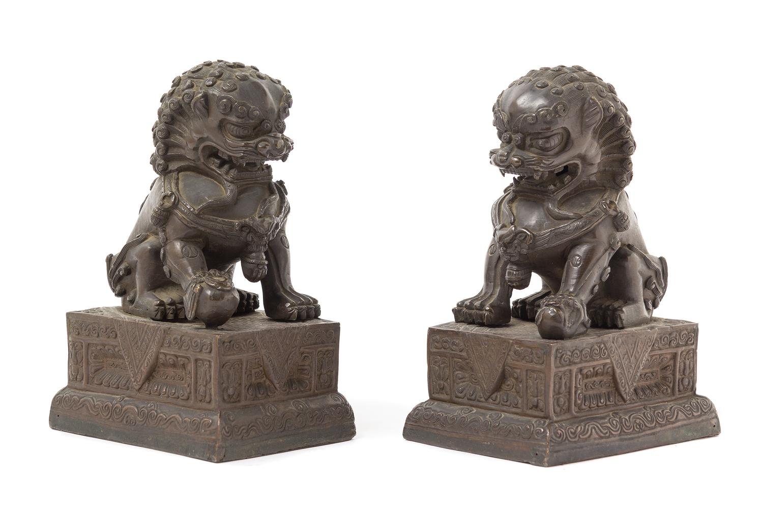 A Pair of Chinese Bronze Temple Guardians 18TH/19TH CENTURY Height 7 1/4 x length 5 1/4 x width 3 3/4 inches. — 18TH/19TH CENTURY
