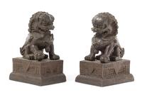 A Pair of Chinese Bronze Temple Guardians 18TH/19TH CENTURY Height 7 1/4 x length 5 1/4 x width 3 3/4 inches. — 18TH/19TH CENTURY