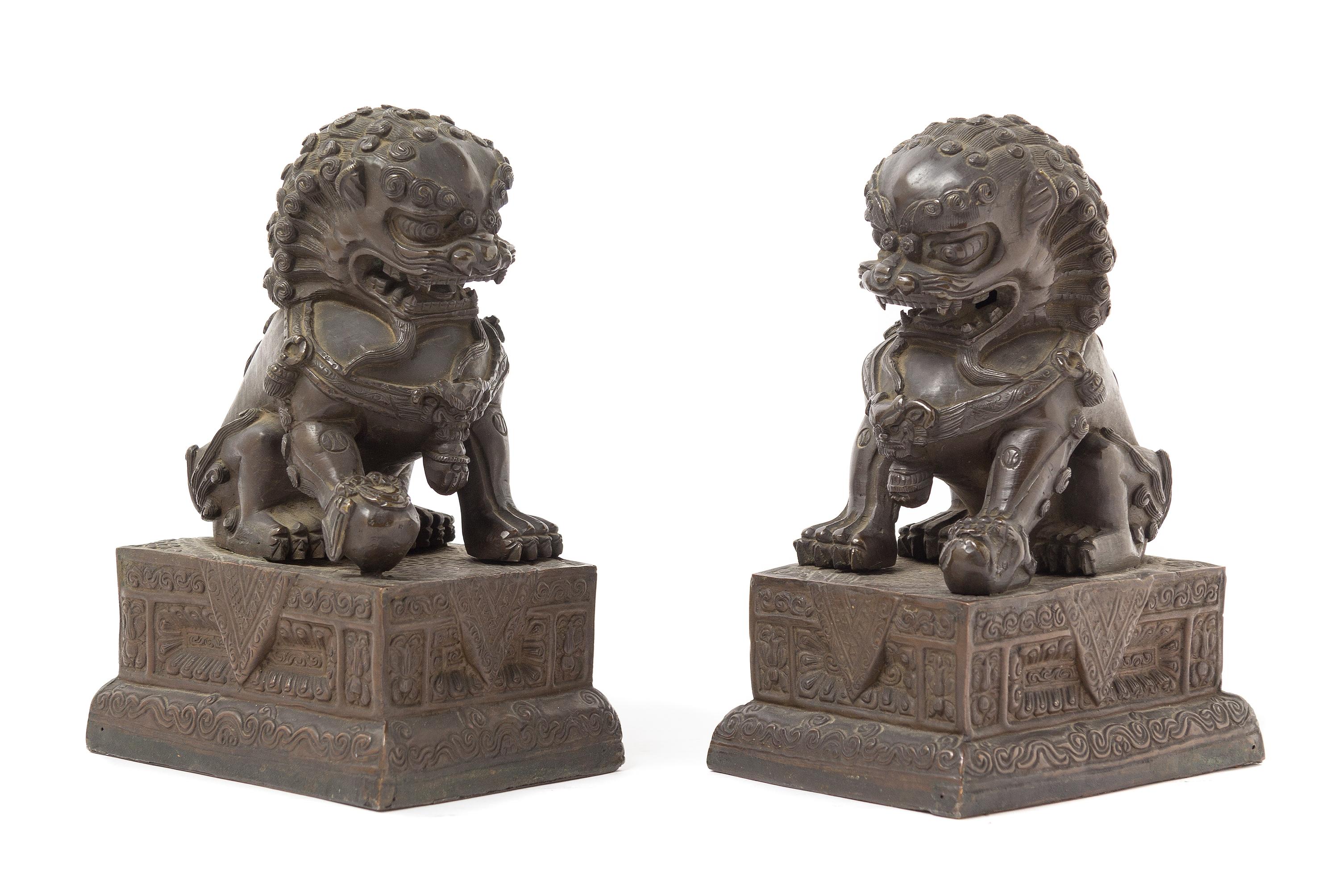 A Pair of Chinese Bronze Temple Guardians 18TH/19TH CENTURY Height 7 1/4 x length 5 1/4 x width 3 3/4 inches. — 18TH/19TH CENTURY