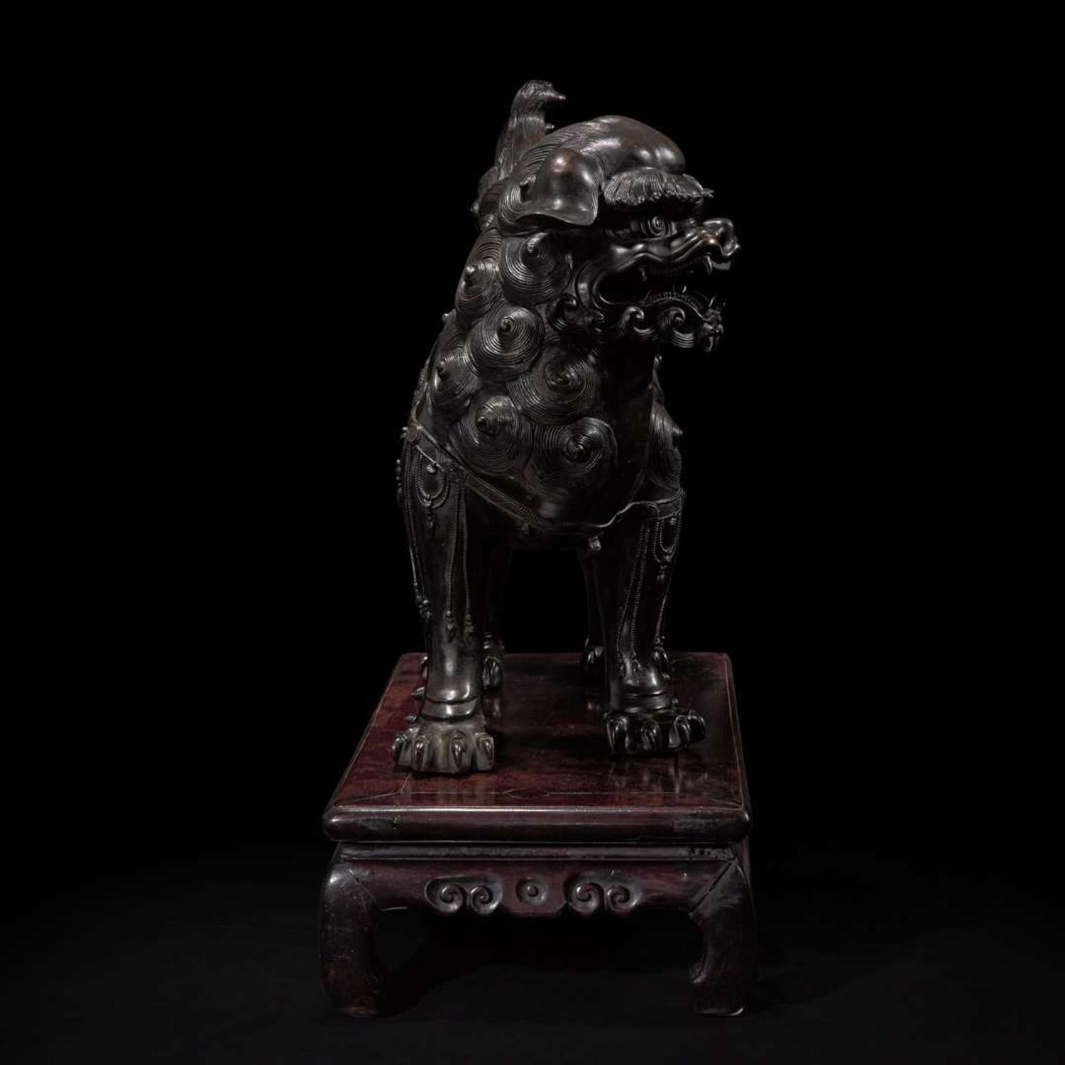 A large Japanese patinated bronze figural censer depicting a Bodhisattva on a lion 日本铜加漆菩萨骑狮像 19th/20th century ???????