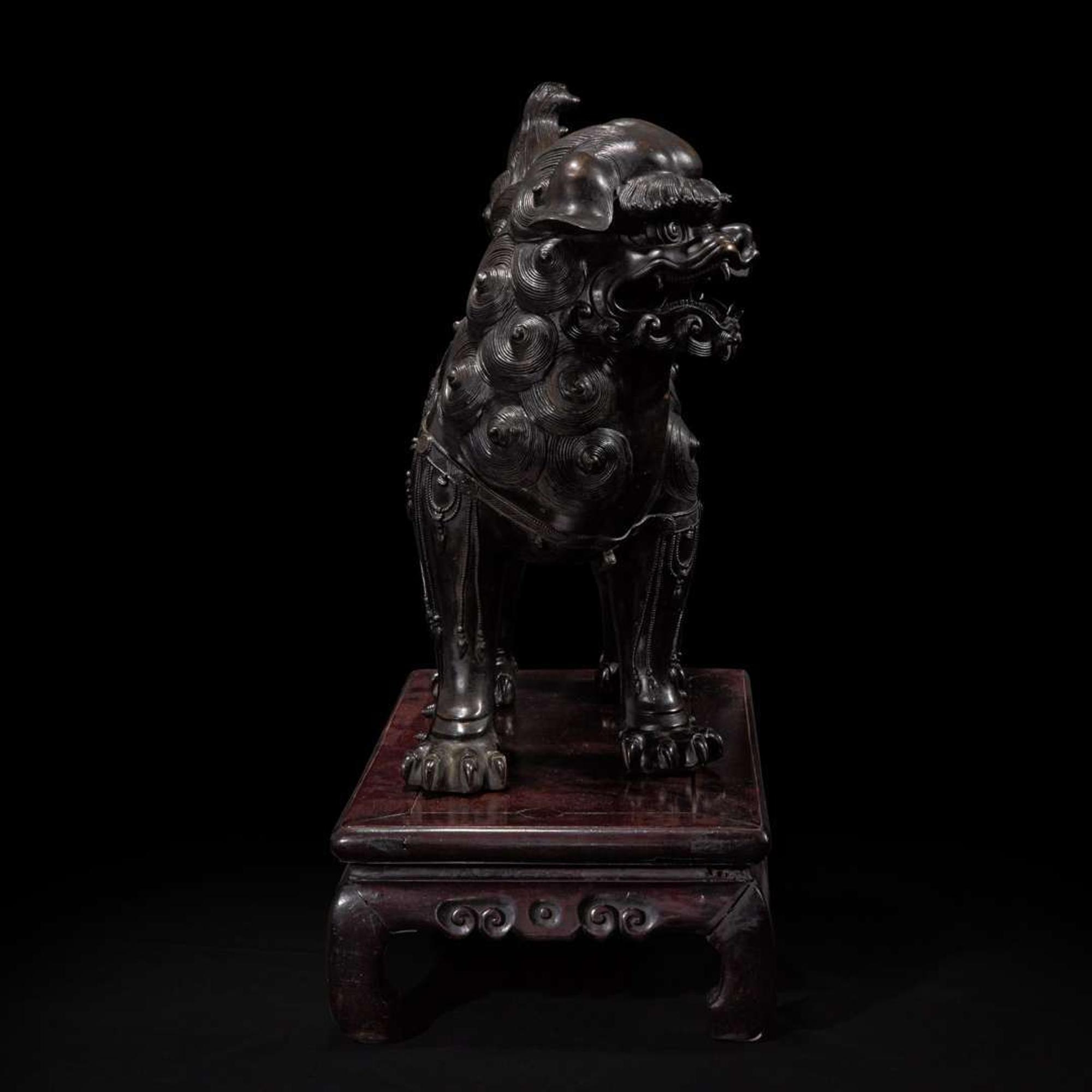 A large Japanese patinated bronze figural censer depicting a Bodhisattva on a lion 日本铜加漆菩萨骑狮像 19th/20th century ???????