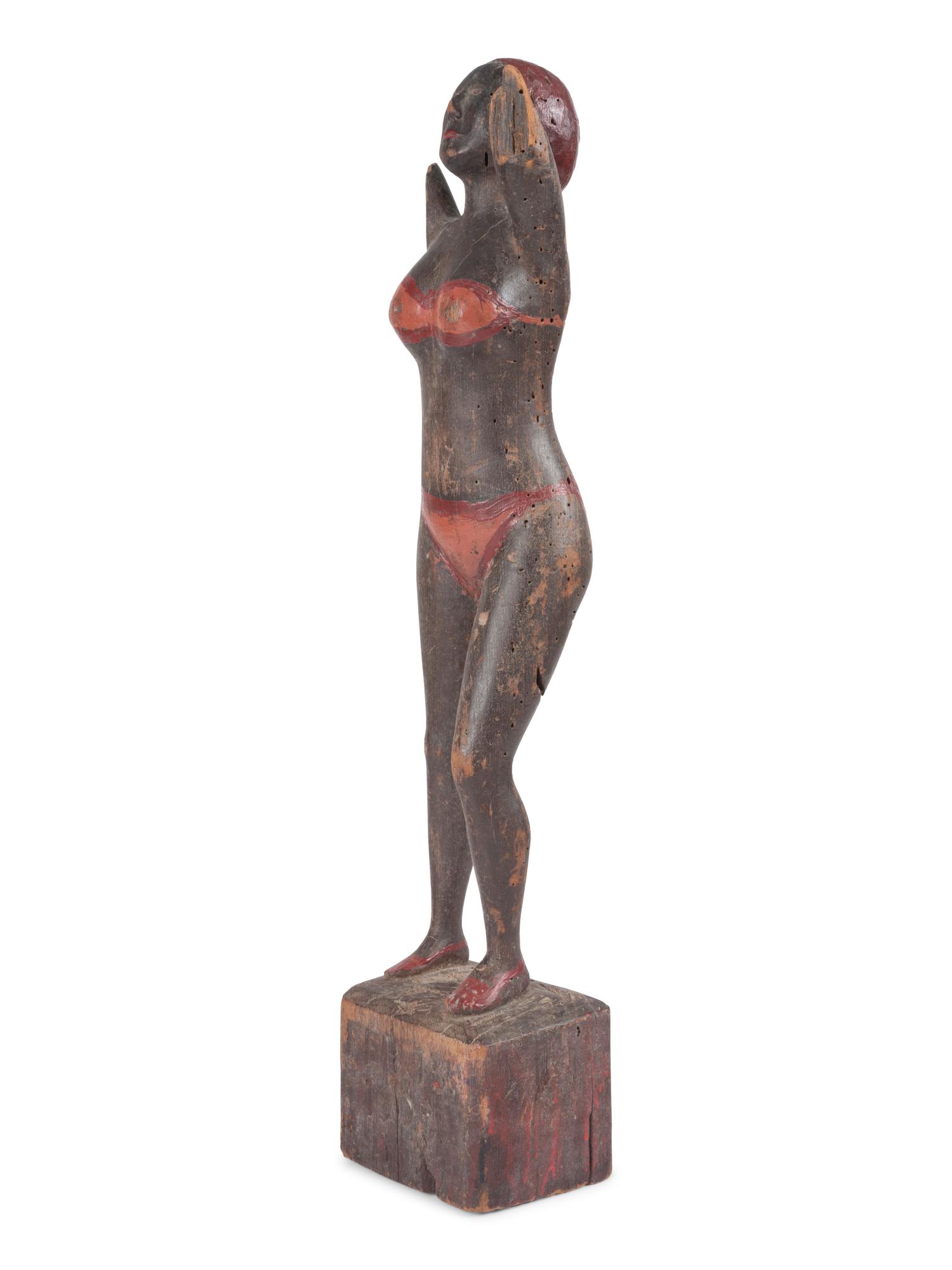 A Carved and Painted Wood Bather Figure