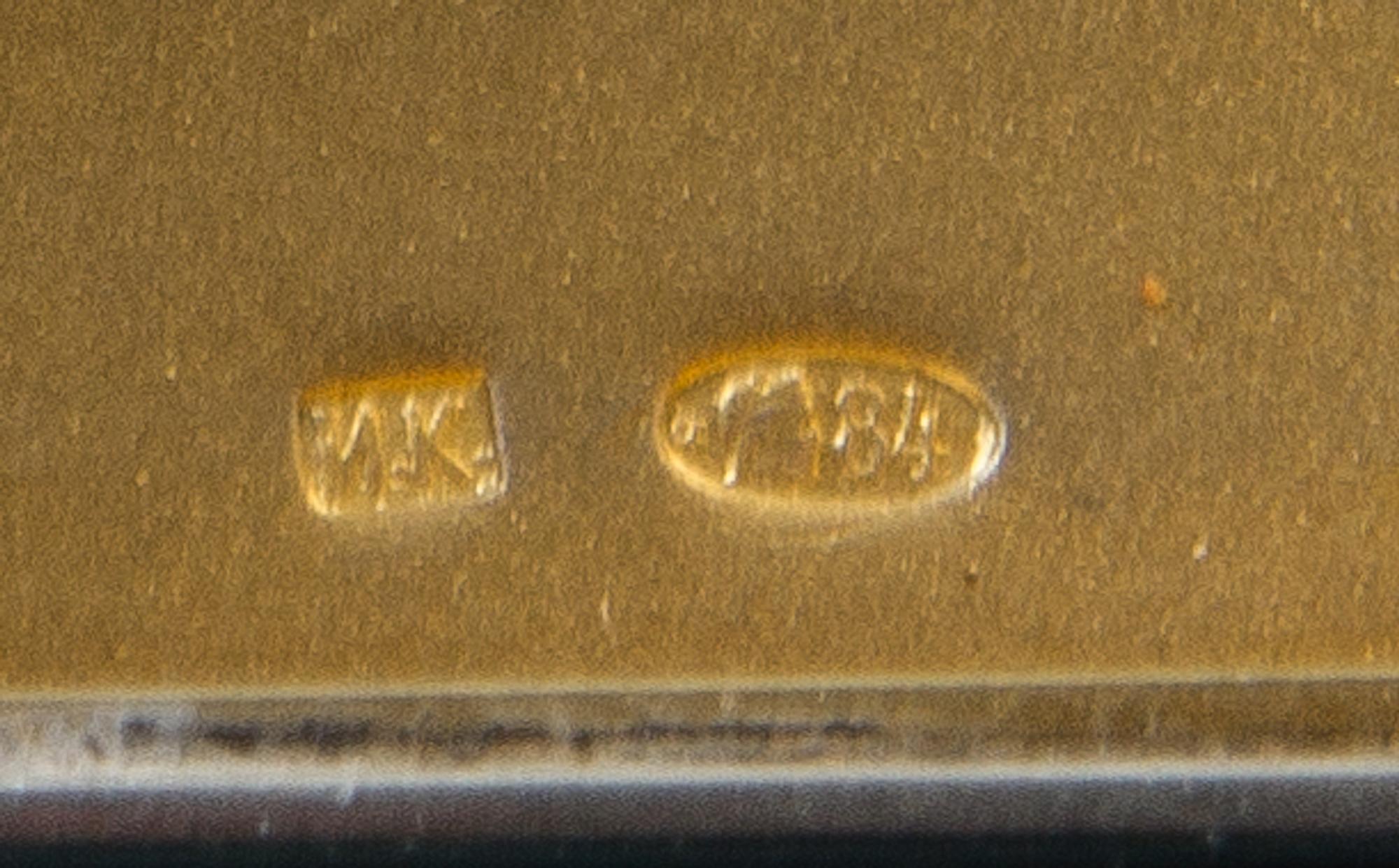 A Russian Silver Cigarette Case, Mark of Ivan Kurtikov, St. Petersburg, early 20th century, the case having diagonal reeded decoration