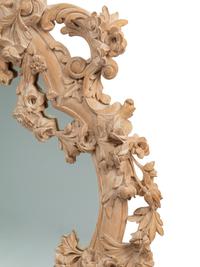 A German Rococo Style Limed Wood Overmantel Mirror