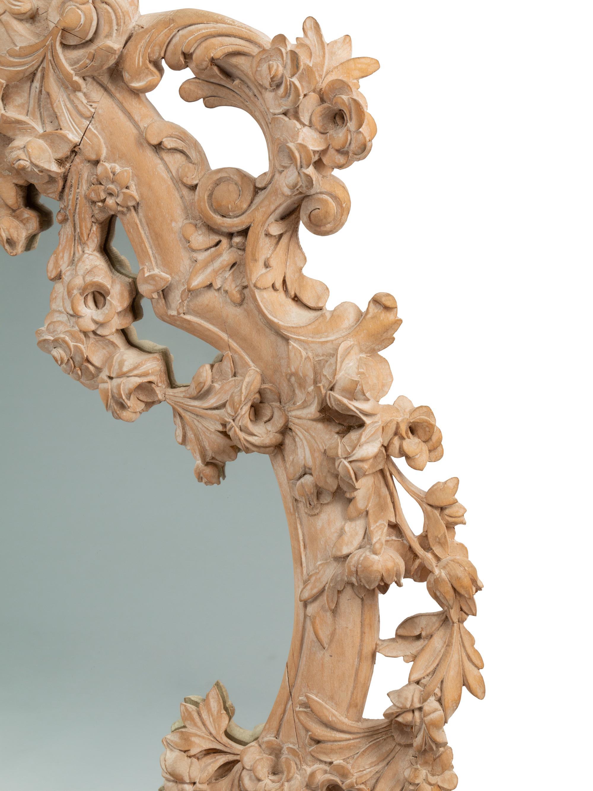 A German Rococo Style Limed Wood Overmantel Mirror