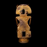 A Tairona Tumbaga Finial with a Shaman atop a Bird