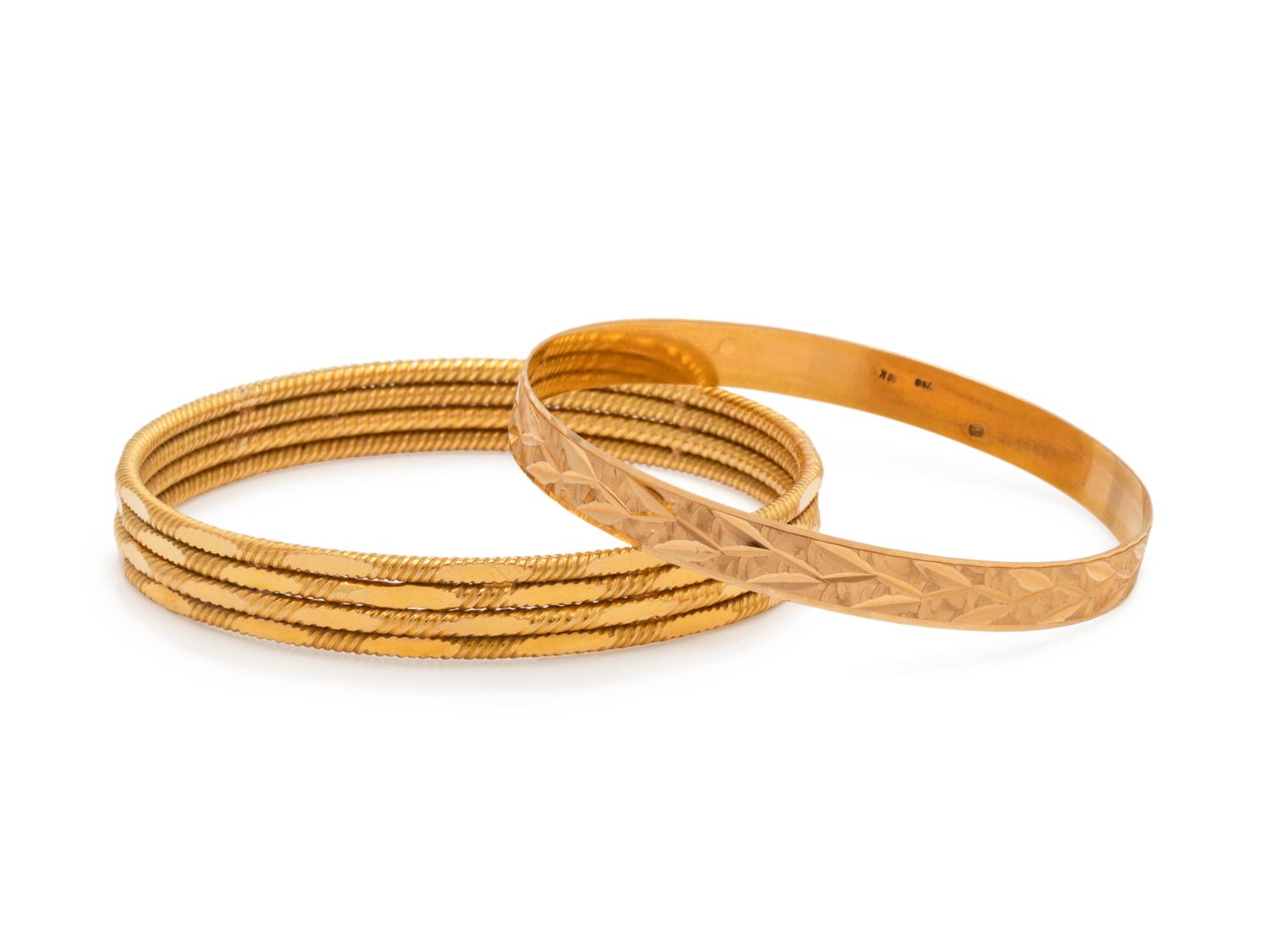COLLECTION OF YELLOW GOLD BANGLE BRACELETS