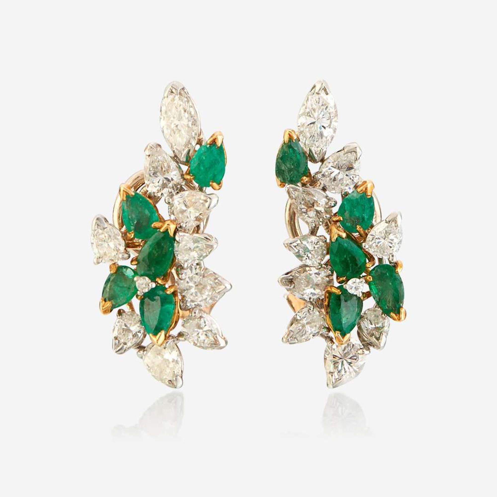 A pair of diamond, emerald, gold, and platinum ear clips