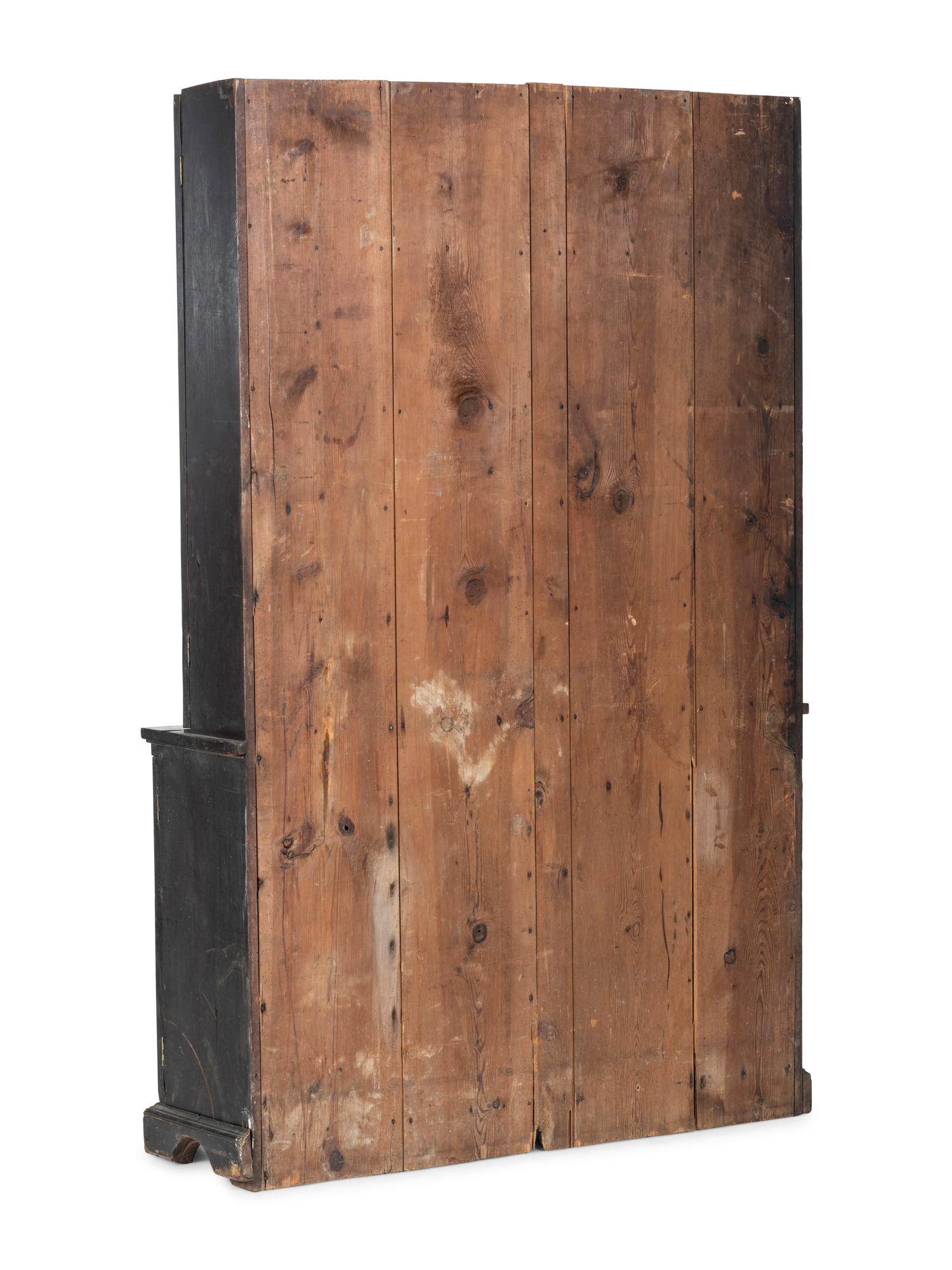 A Chippendale Style Walnut Paneled Step Back Cupboard