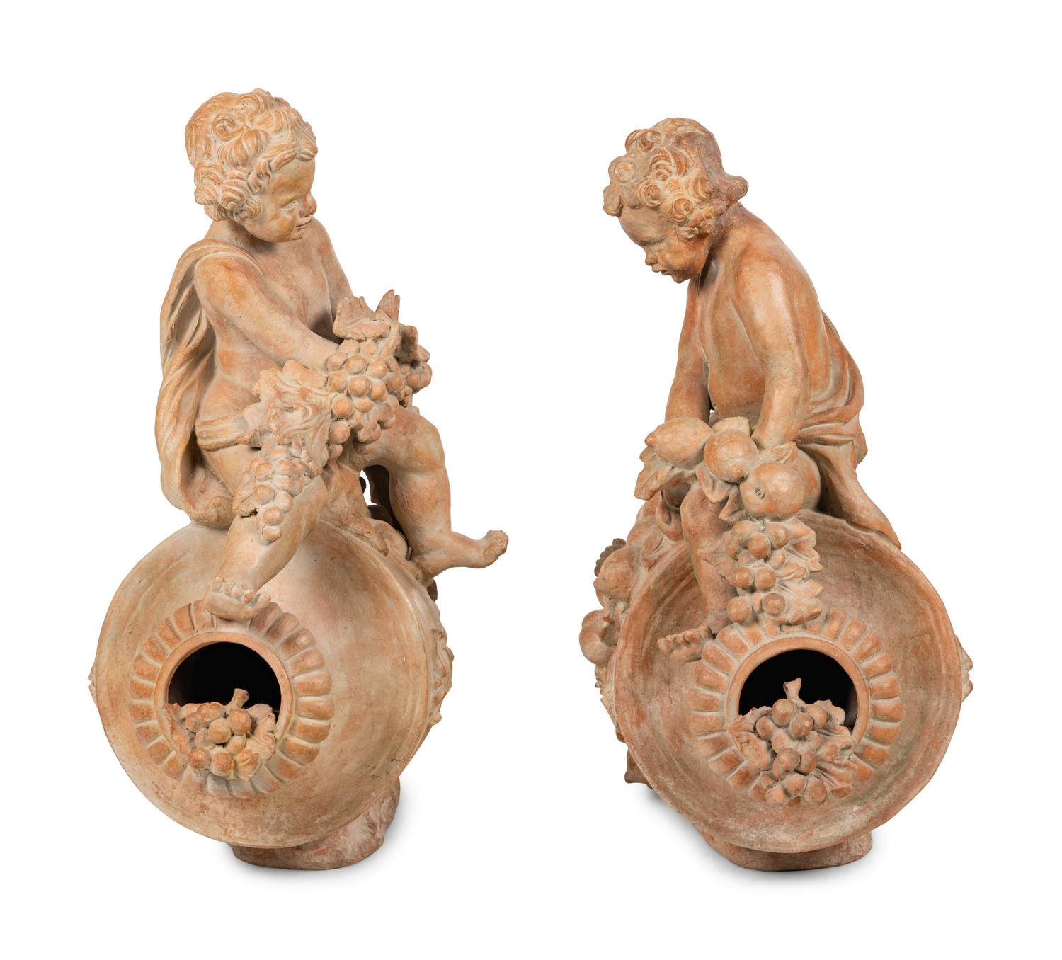A Pair of Terra Cotta Putti Ornaments