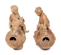 A Pair of Terra Cotta Putti Ornaments