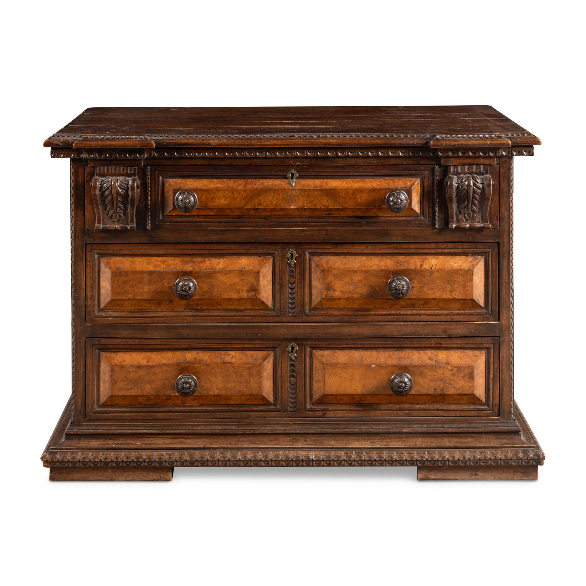 An Italian Carved Walnut Chest of Drawers