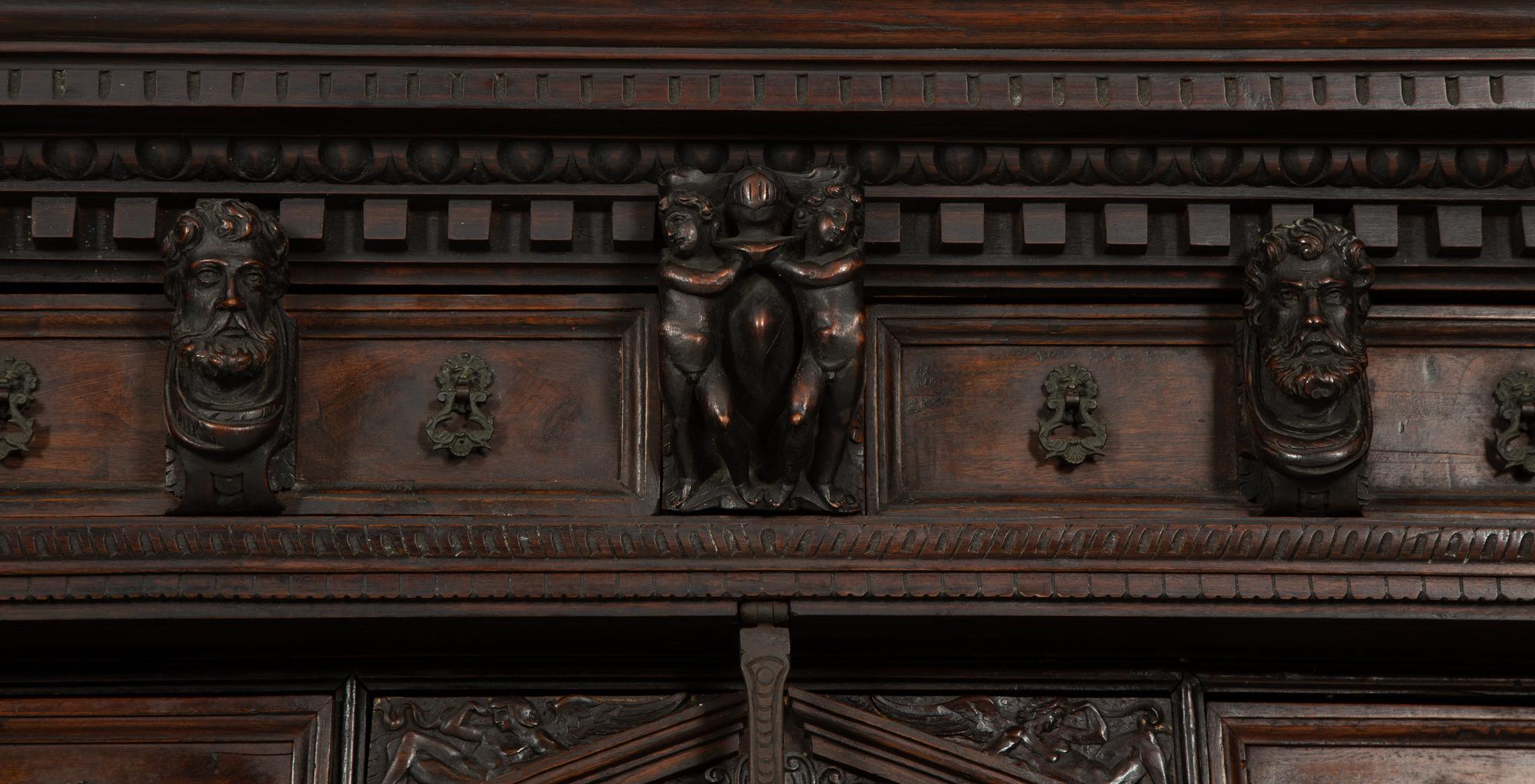 A Continental Baroque Walnut Cabinet