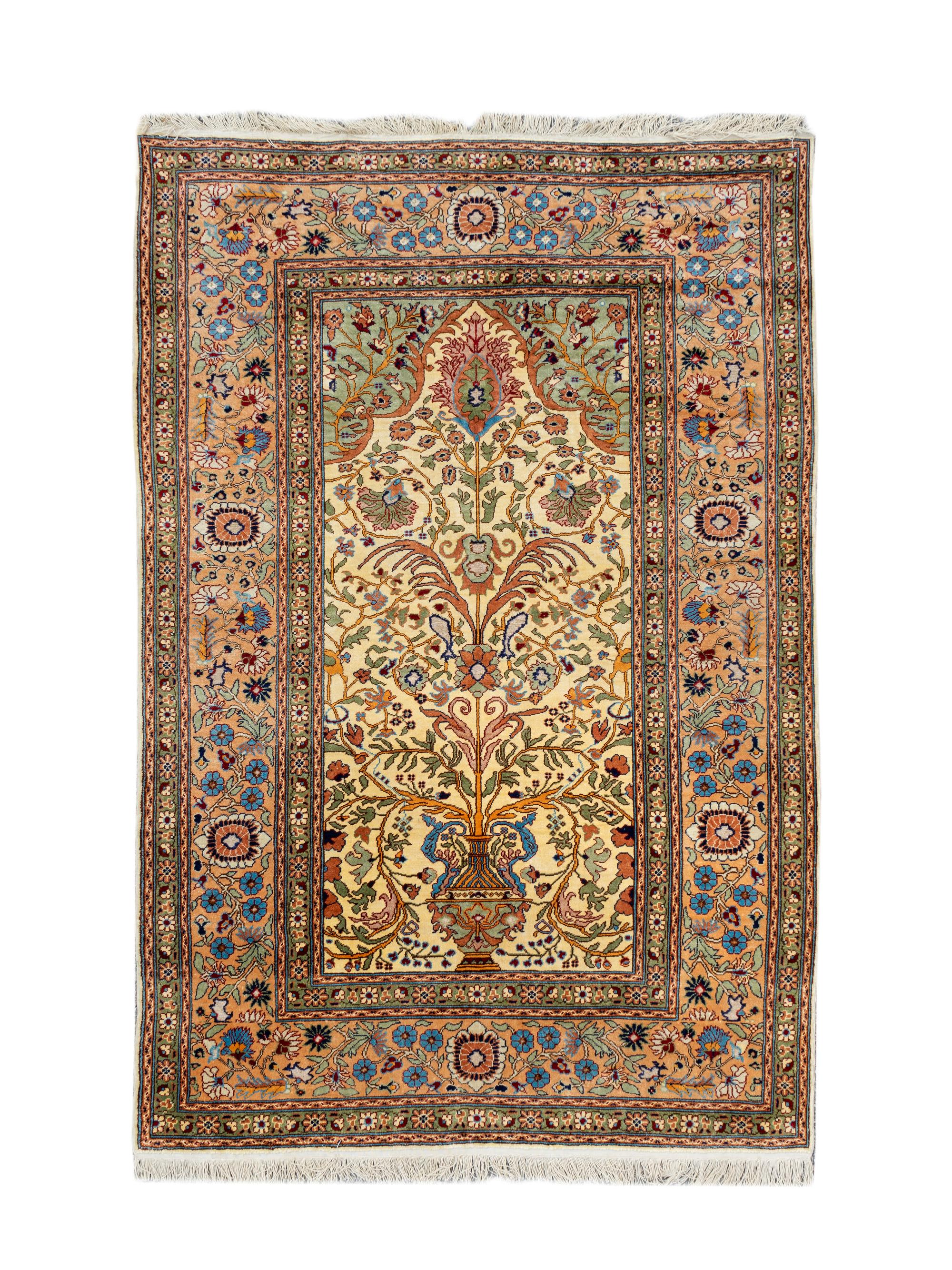 A Hereke Silk Prayer Rug — 20TH CENTURY