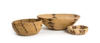 Three California Baskets Height of largest 3 3/4 x diameter 12 1/2 inches.