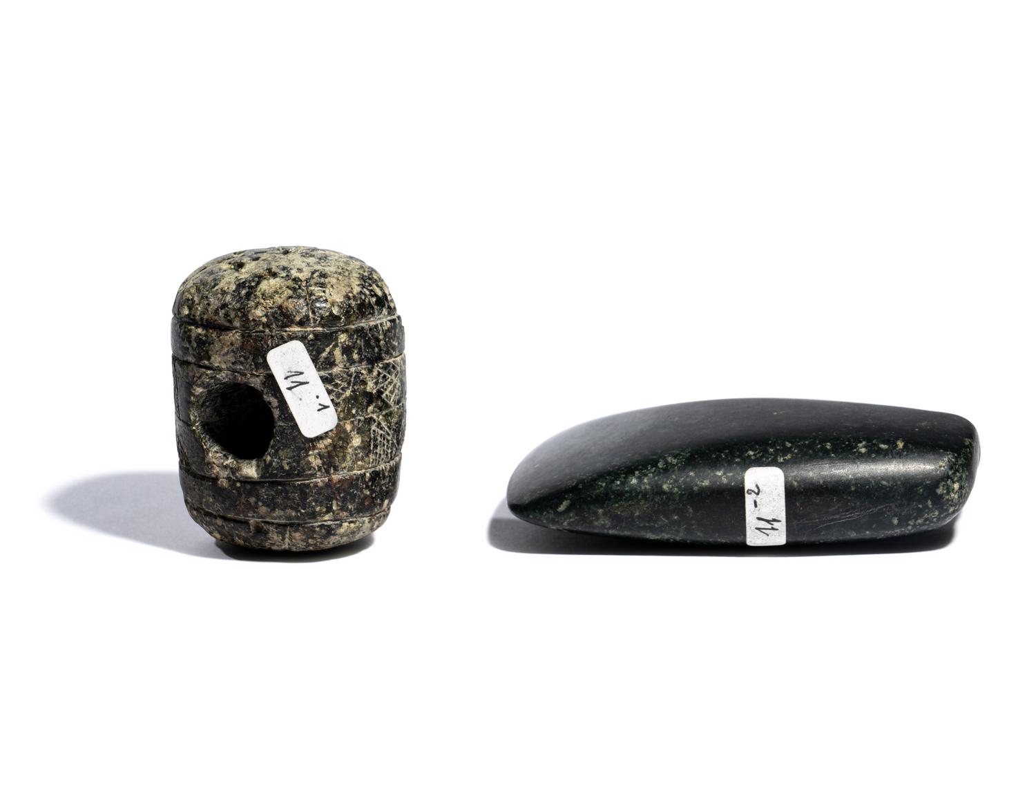 Two Near Eastern Stone Tools — An engraved macehead and axehead