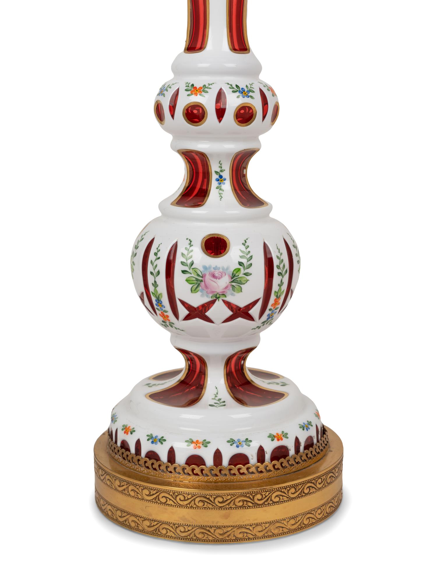 A Pair of Bohemian Enameled White Overlay Ruby Glass Lamps