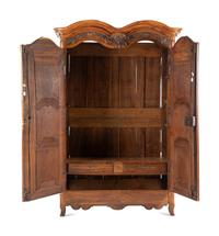 A Louis XV Carved Walnut Armoire