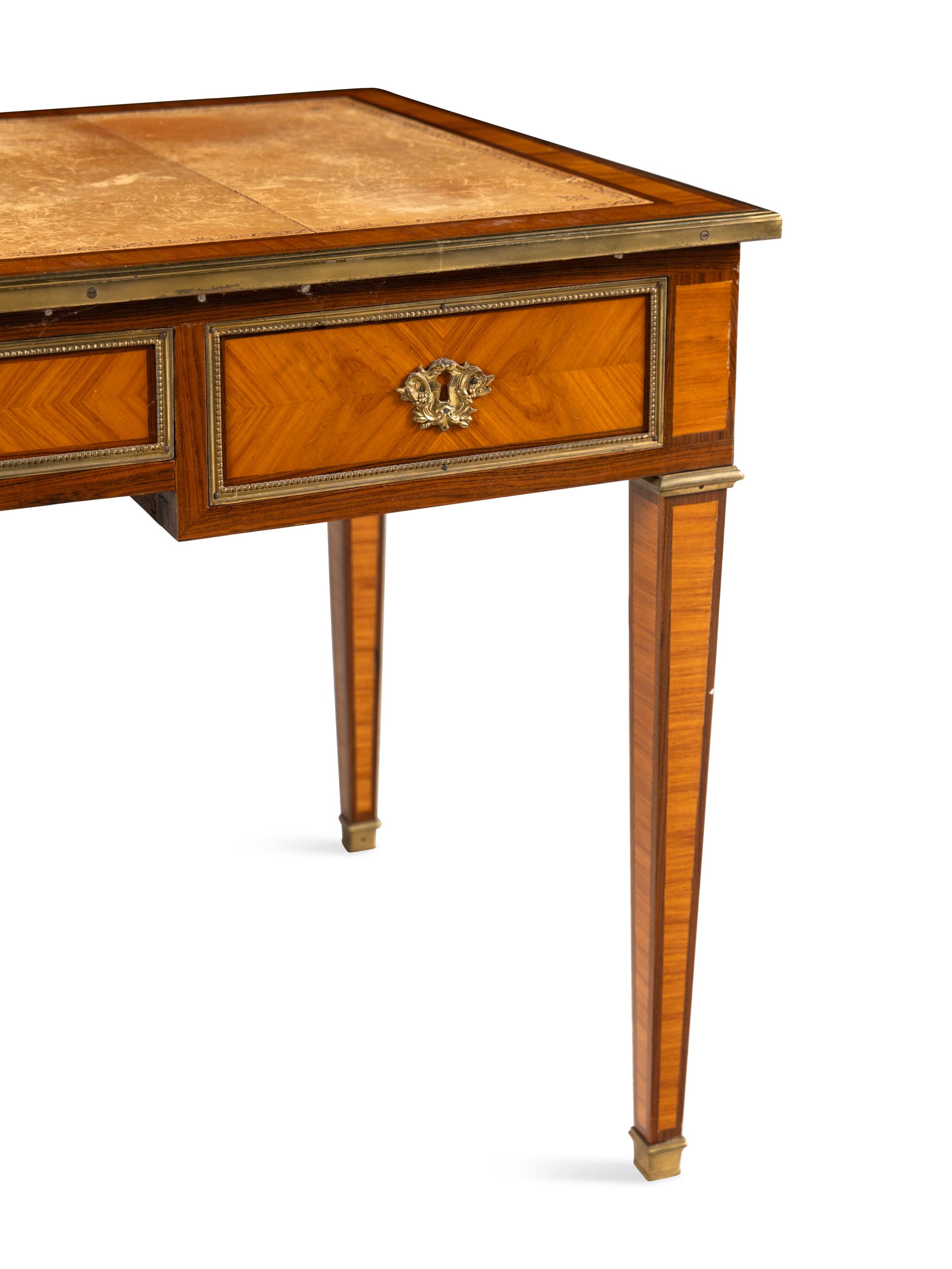 A Directoire Gilt Bronze Mounted Kingwood and Bois Satiné Bureau Plat