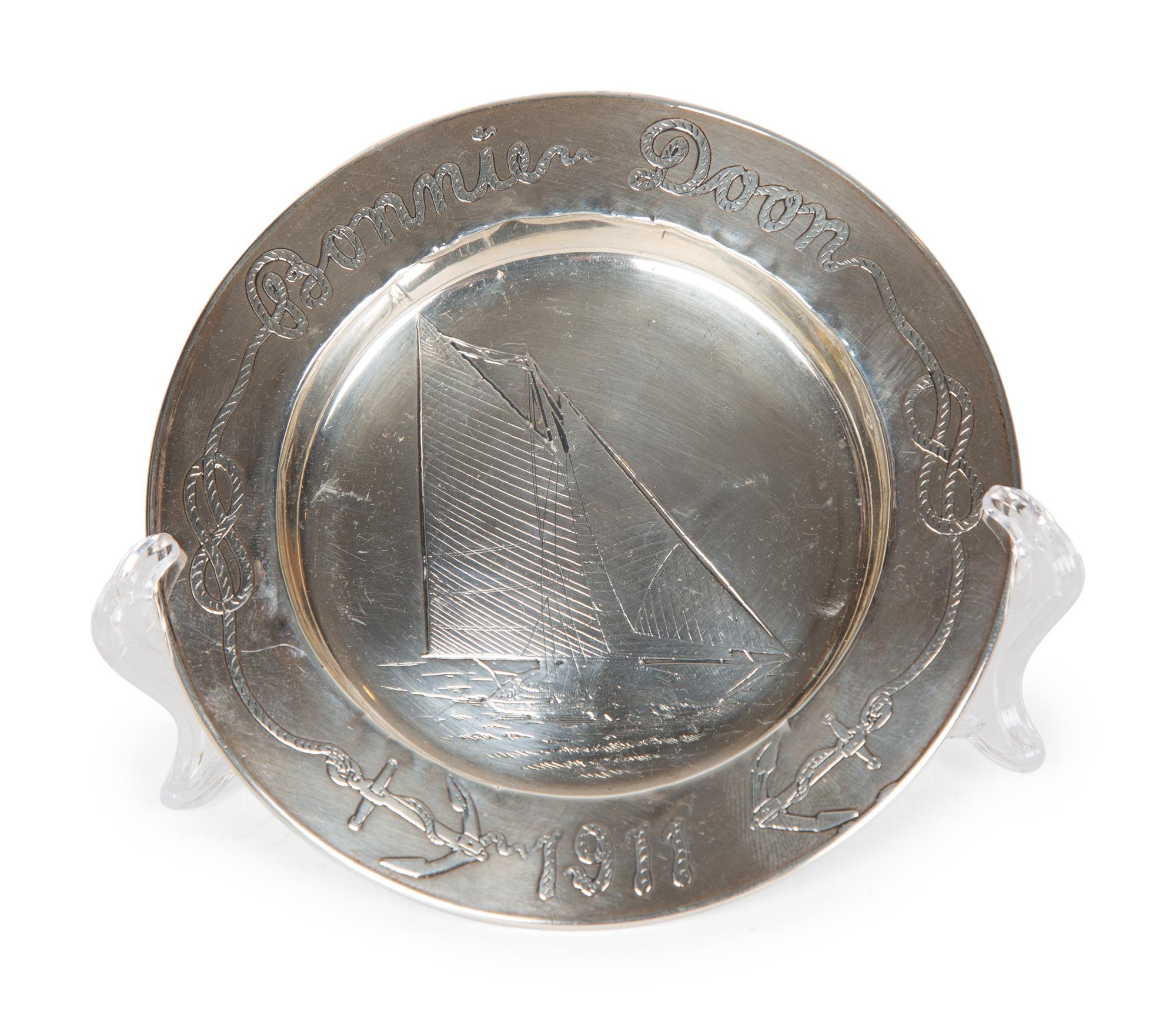 A Garrard & Co Silvered Figural Standing Salt and an Asprey Silver Bonnie Doon Commemorative Ashtray