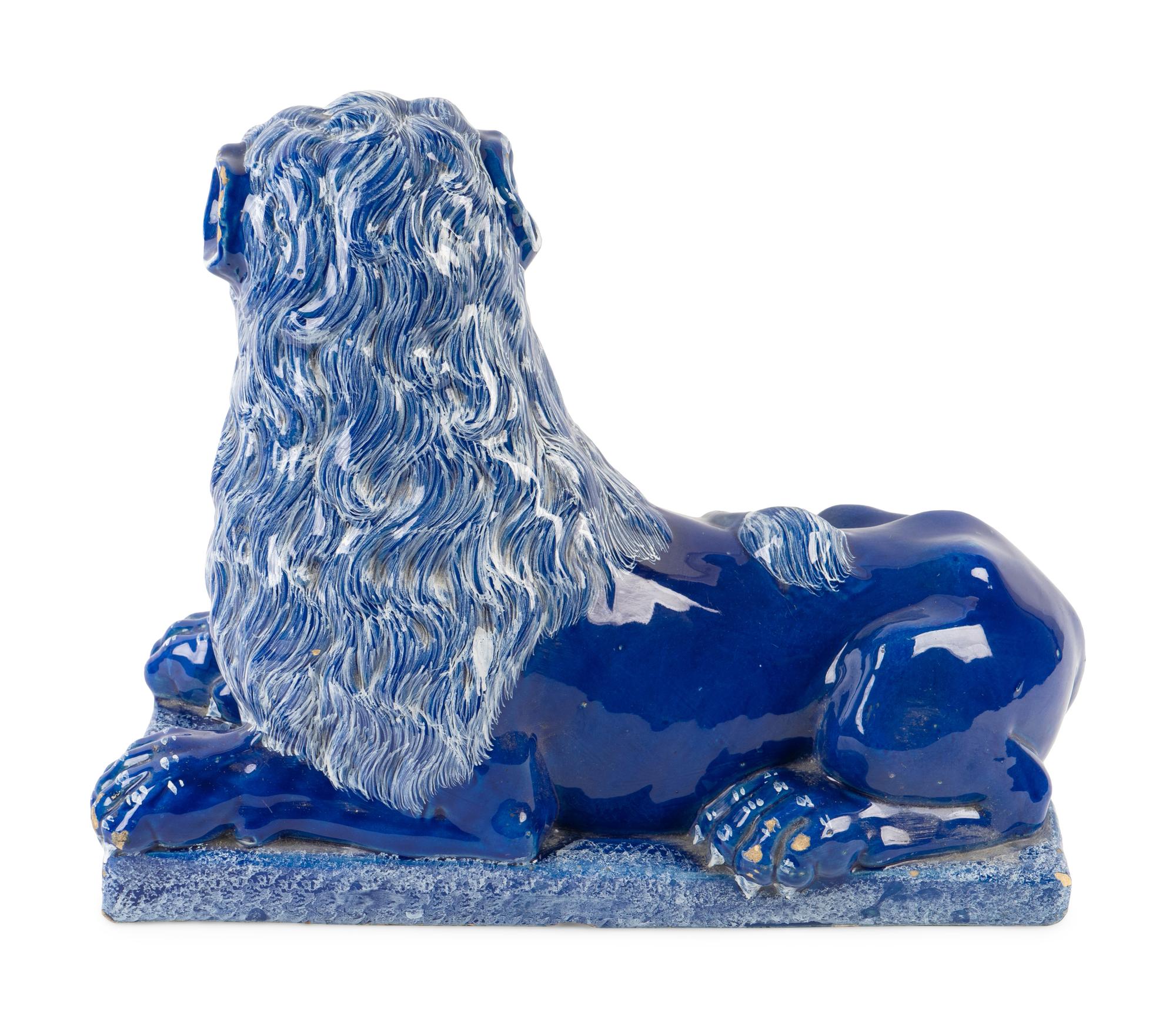 A Luneville Style Blue-Glazed Faience Recumbent Lion