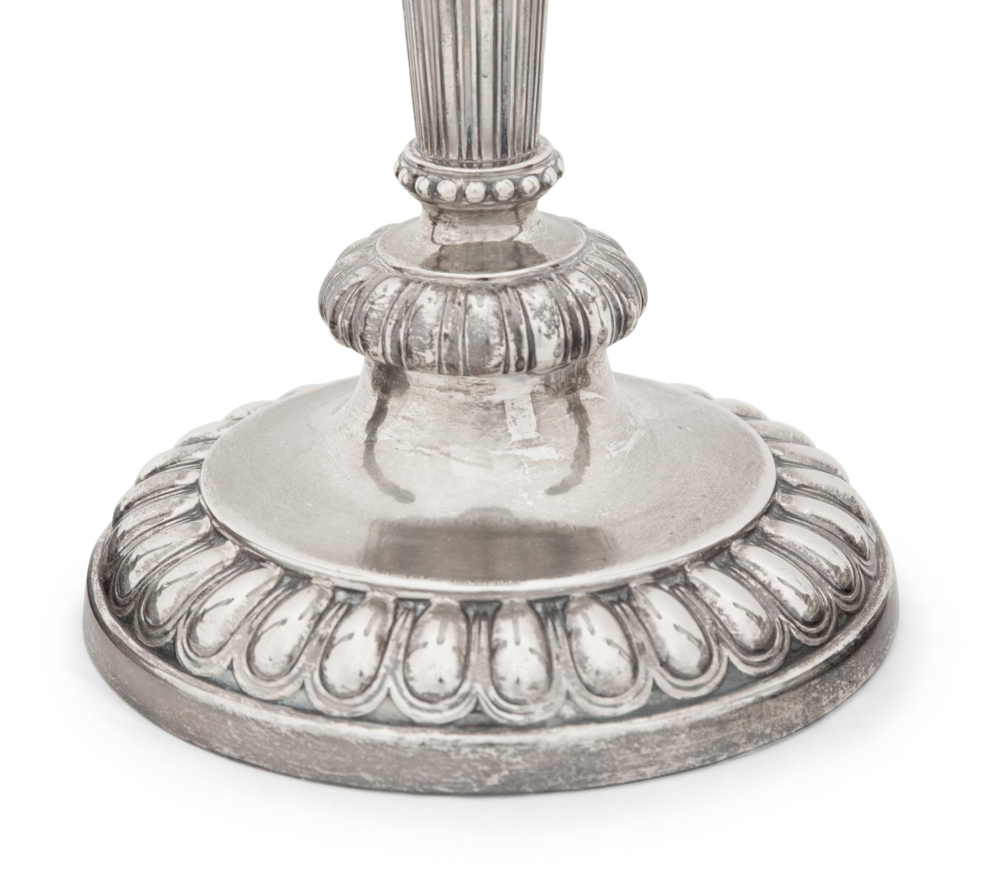 A Set of Four Victorian Silver Candlesticks
