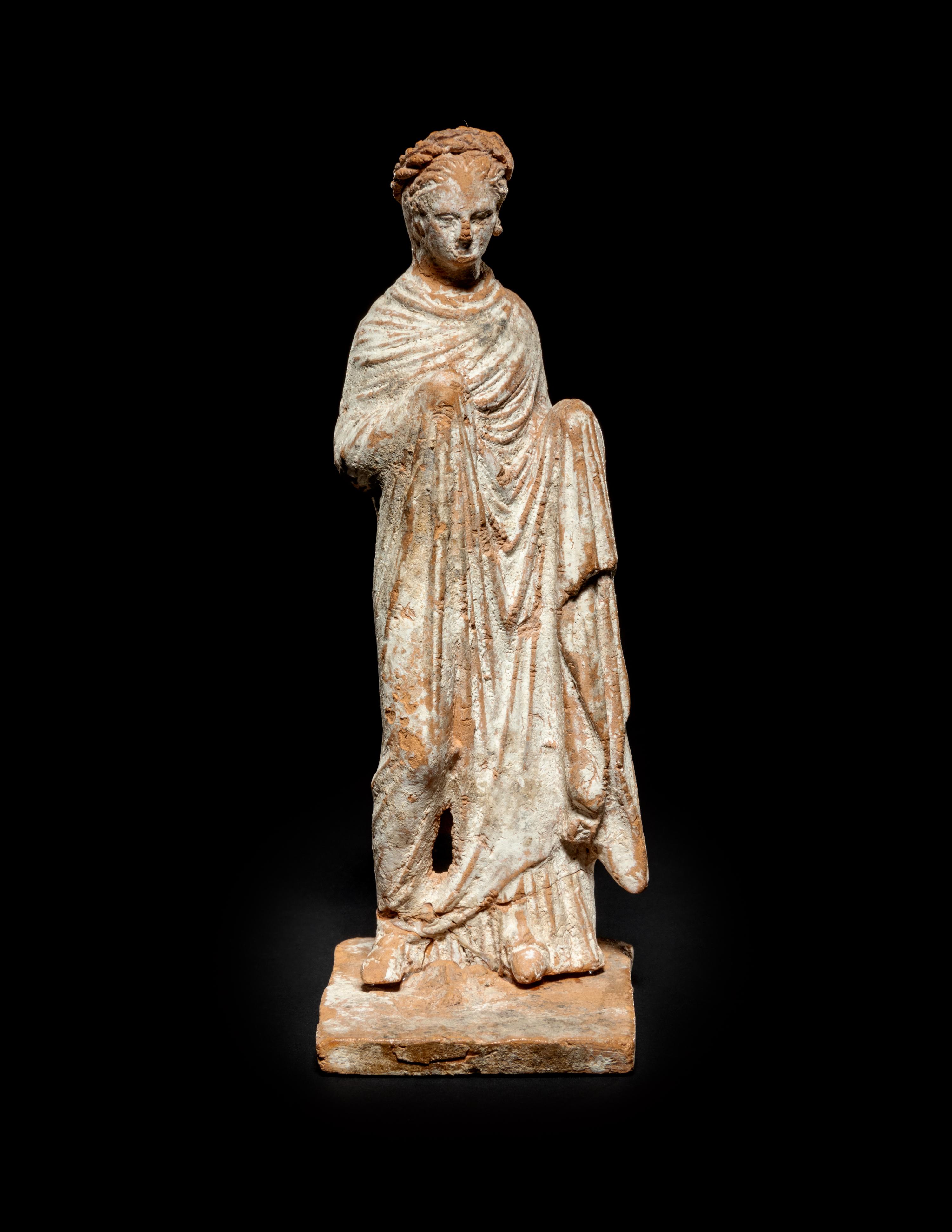 A Greek Terra Cotta Draped Female Figure