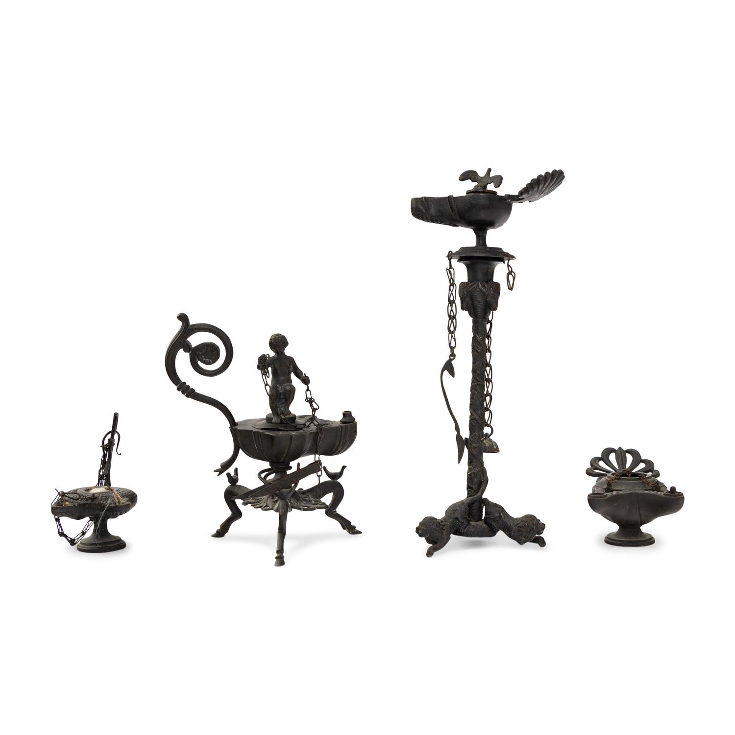 A Collection of Four Patinated Bronze Oil Lamps
